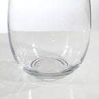 Rounded transparent vase with a narrow neck