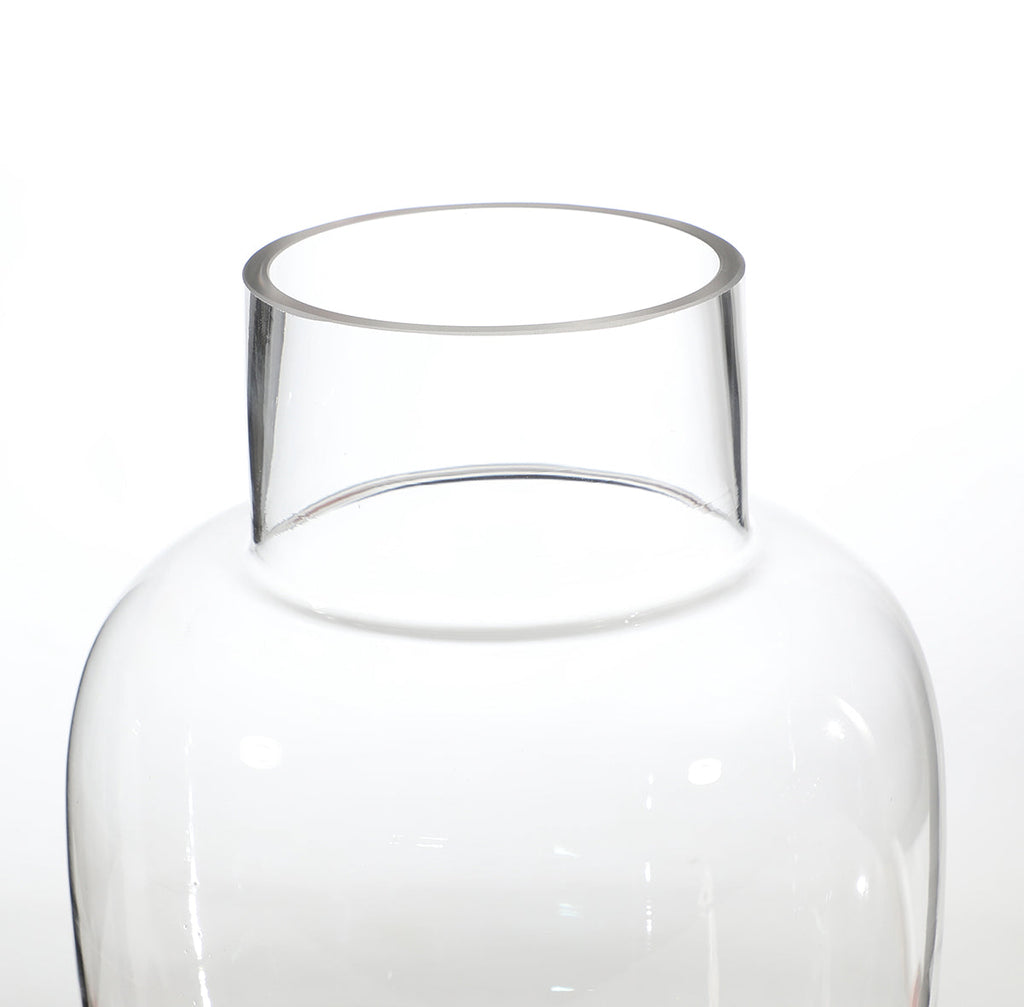 Rounded transparent vase with a wide neck