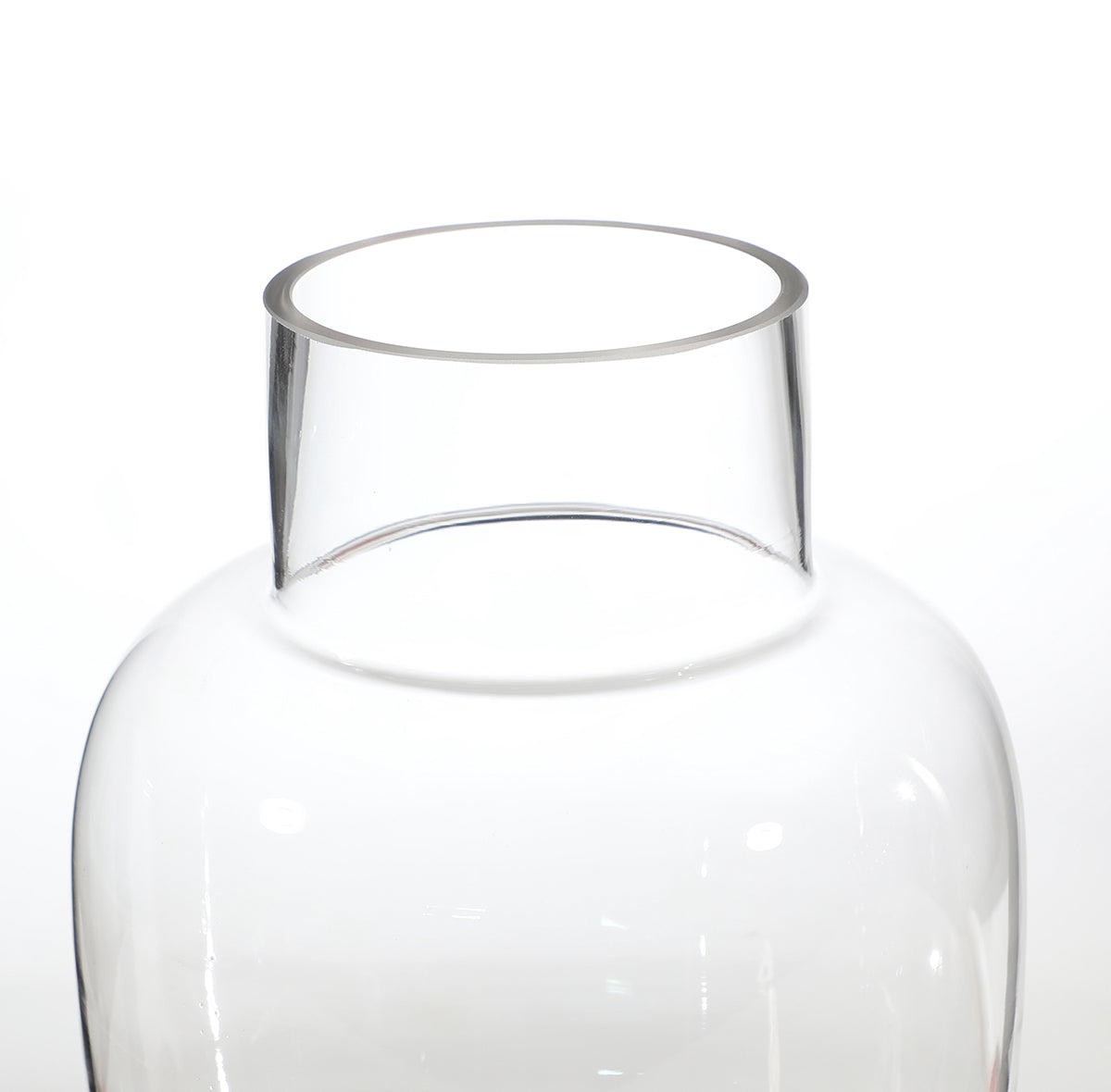 Rounded transparent vase with a wide neck