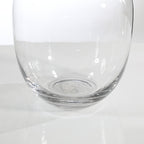Rounded transparent vase with a wide neck