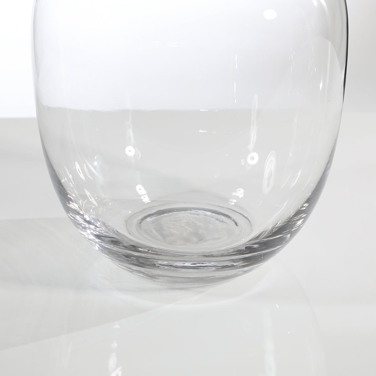 Rounded transparent vase with a wide neck